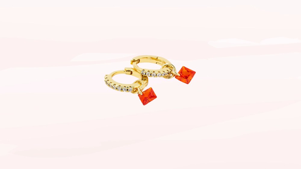 Gold huggie earrings with charm