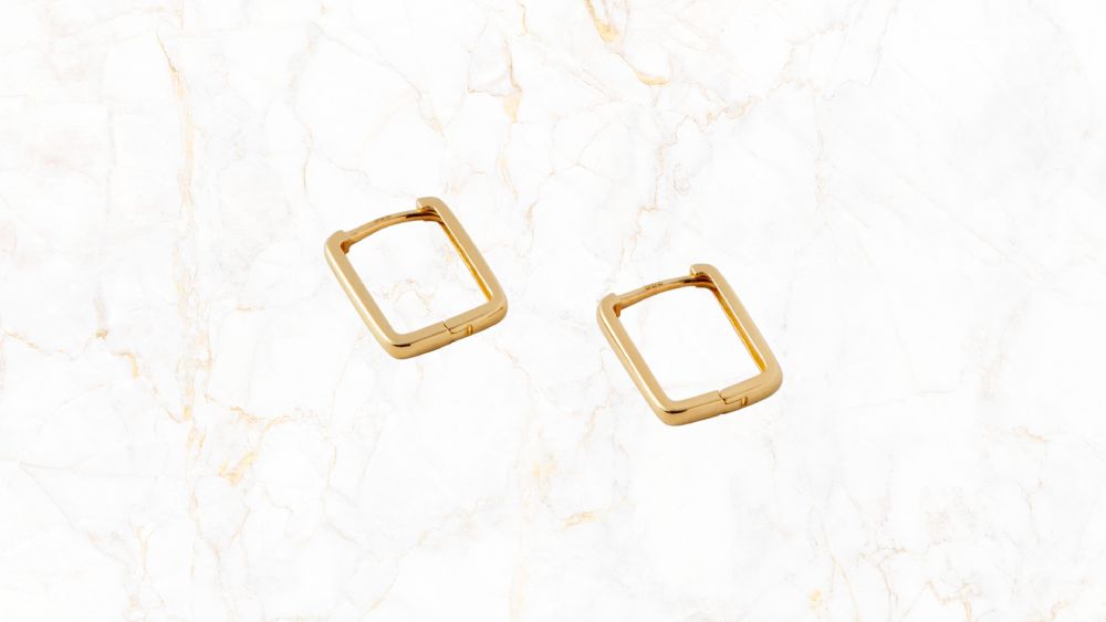 Yellow gold angled hoop earrings shine